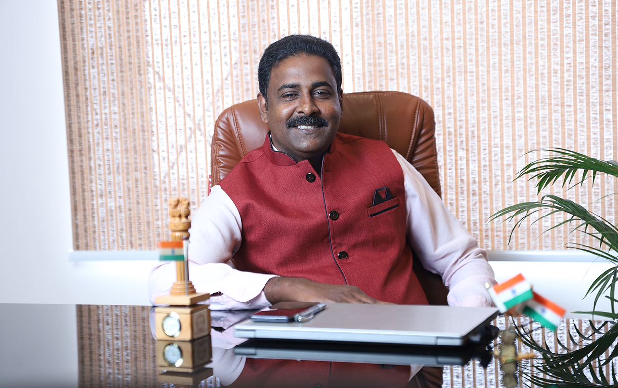 Anil Anil Mathew, Director, at his desk