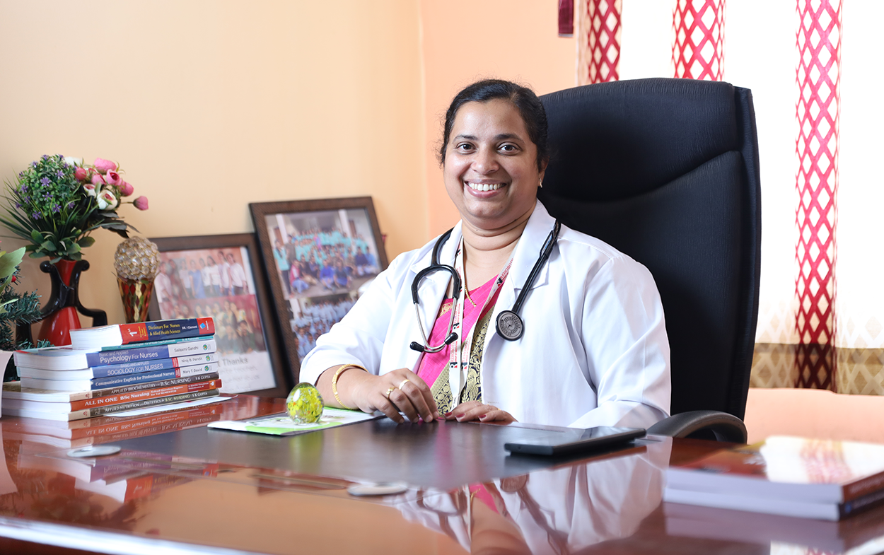 Sherine Sherine Alexander, Principal, at her desk