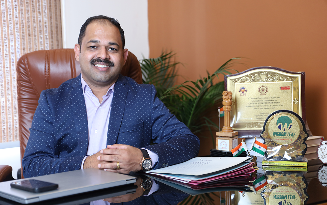 Sibi Sibi Alexander at his desk